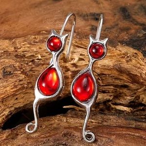 New in box, Tempered cat earrings with red stone silver plated.